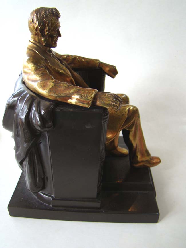 A pair of Abraham Lincoln 'sitting in the chair' bookends by the Philadelphia Manufacturing Company circa 1935 — image 2